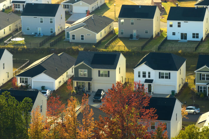 Aerial view of tightly packed homes in South Carolina residential area. New family houses as example of real estate development in american suburbs.